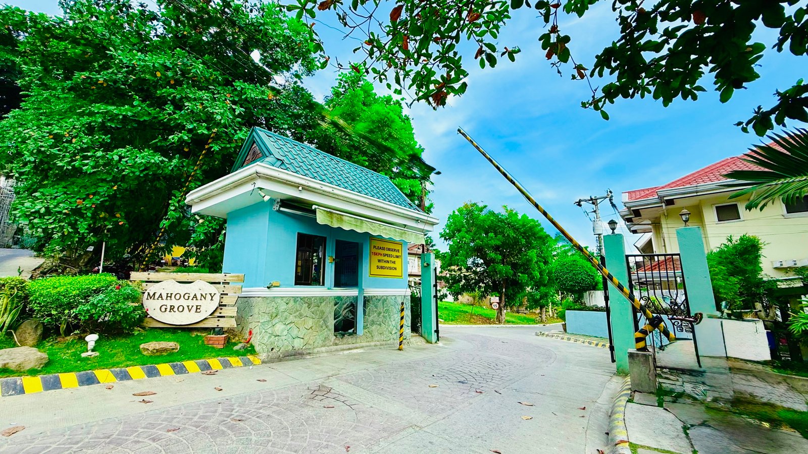 Entrance of Mahogany Grove, an uptown subdivision which has house for rent in Mandaue